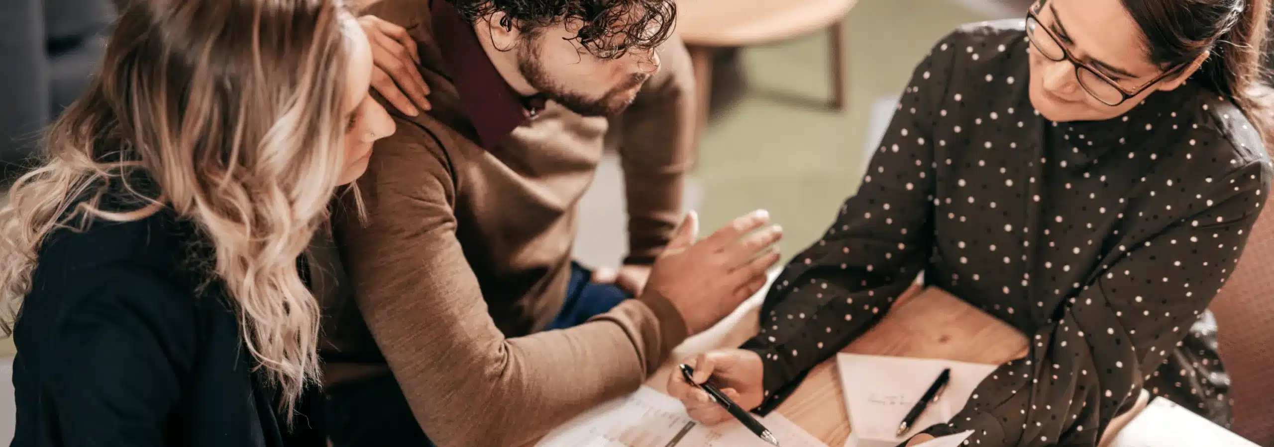 couple signing mortgage papers